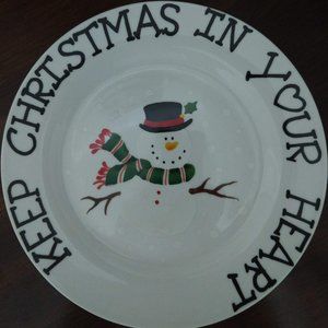 Two snowman and one Santa cookie plates.